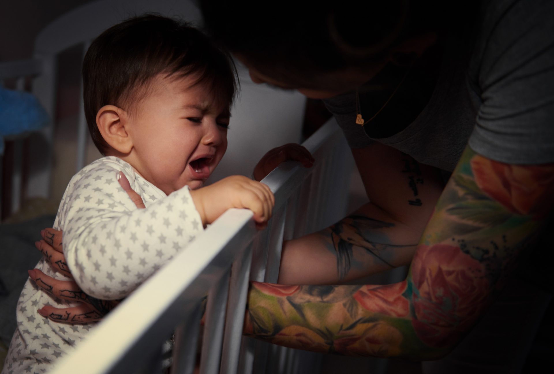 mummy lulling baby to sleep