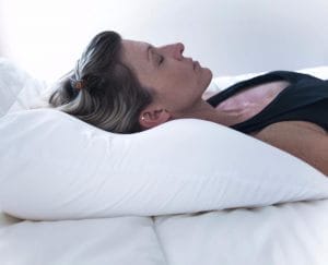 Review of the Nitetronic Nitelink App lady sleeping on snore no more pillow e1578764796455.jpg